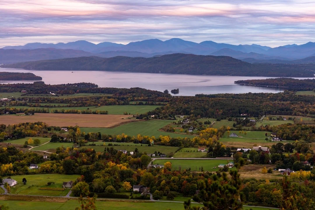 Vermont landscape with farms in the foreground, Lake Champlain and Adirondacks in the background