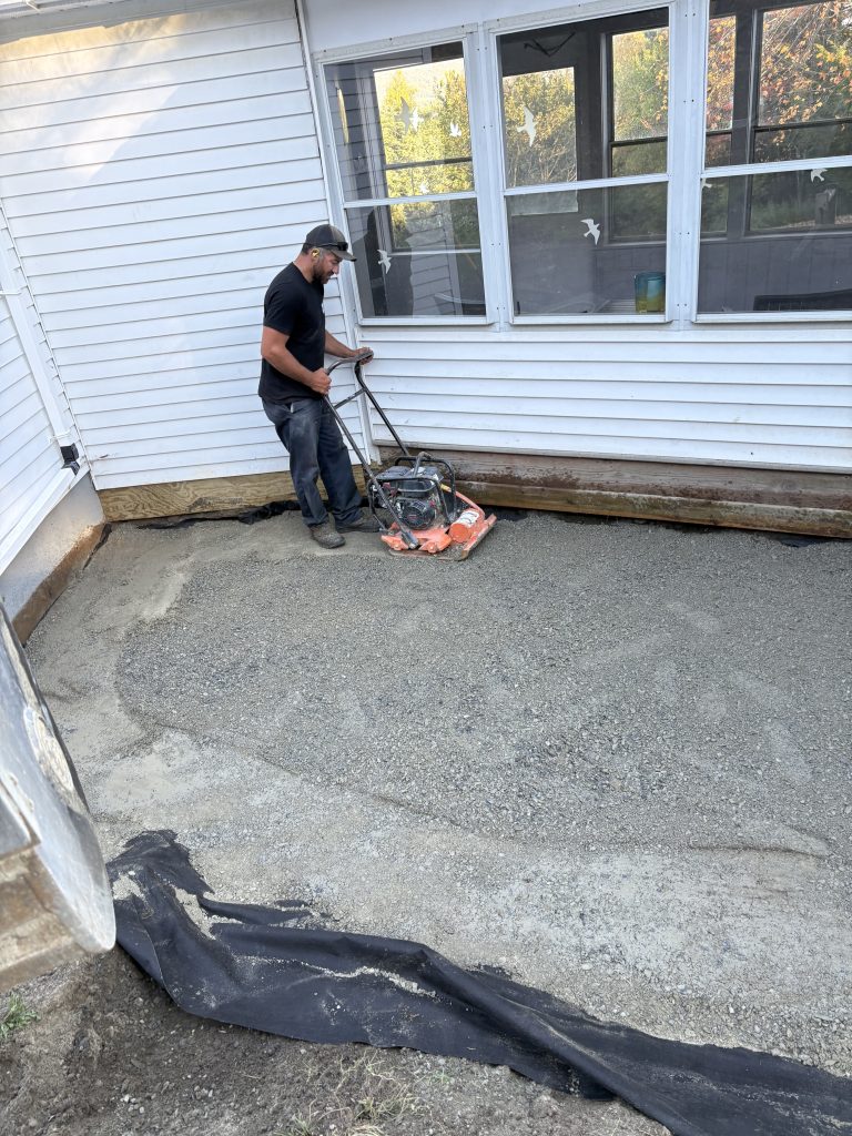 a patio in the process of being compacted and graded